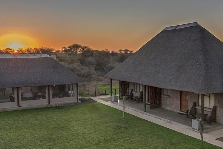A courtyard at dusk at Zaagkuilsdrift Bird Sanctuary and Lodge
